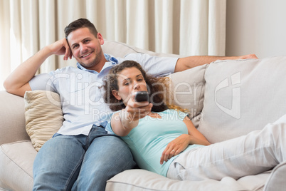 Young couple watching TV