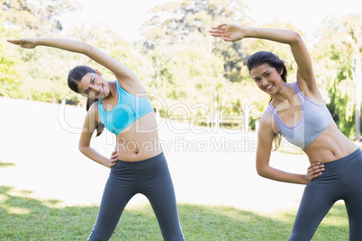 Women stretching in park