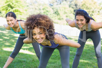 Smiling sporty women exercising