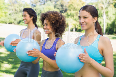 Sporty women exercising with medicine balls