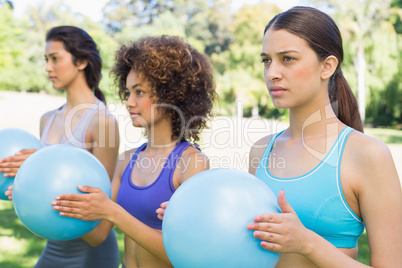 Women exercising with medicine balls