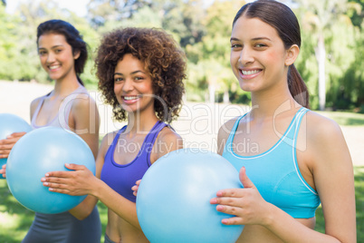 Happy women exercising with medicine balls