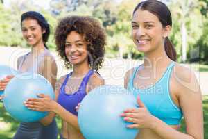 Happy women exercising with medicine balls