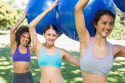 Women exercising with fitness balls