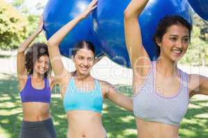 Women exercising with fitness balls