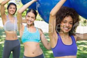 Fit women exercising with fitness balls