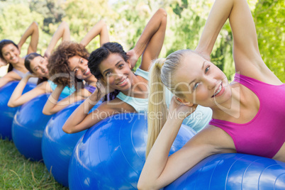Sporty women balancing on pilates