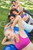 Portrait of sporty women balancing on pilates