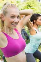 Woman exercising with friends