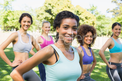 Confident women exercising in park