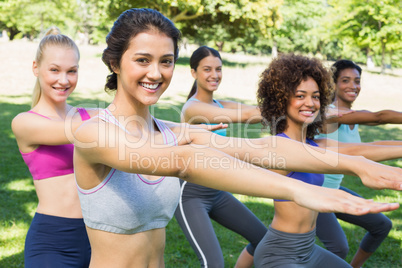 Fit women stretching in park