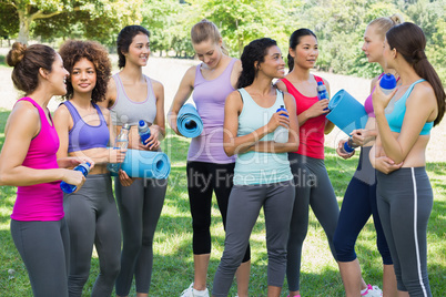 Multiethnic sporty women talking in park