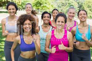 Happy female friends jogging in park