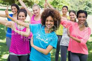 Friends performing Zumba dance in park