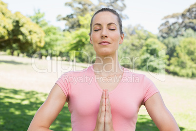 Woman mediating in park