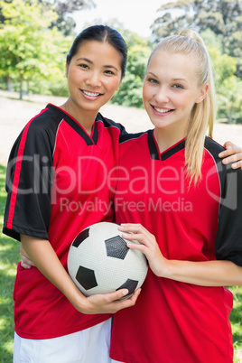 Confident multiethnic soccer players