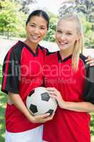 Confident multiethnic soccer players