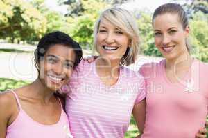 Multiethnic volunteers participating in breast cancer awareness