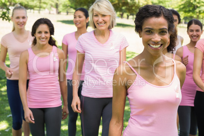 Women participating in breast cancer awareness at park