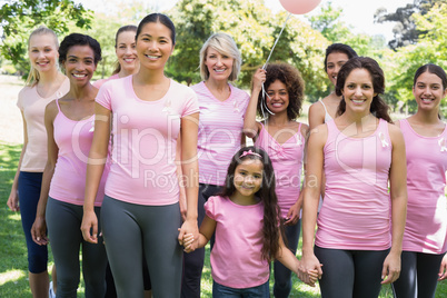 Multiethnic females supporting breast cancer awareness