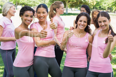 Breast cancer participants gesturing thumbs up