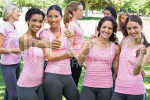 Breast cancer participants gesturing thumbs up