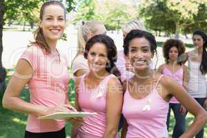 Volunteer and participants at breast cancer campaign