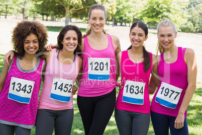 Confident women participating in breast cancer marathon