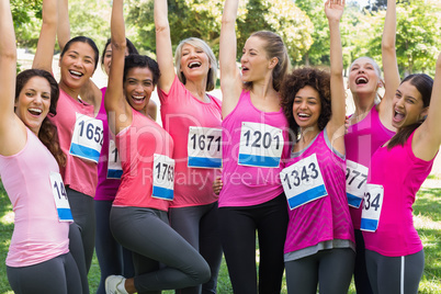 Female breast cancer marathon runners cheering