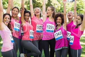 Female breast cancer marathon runners cheering