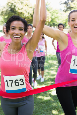 Breast cancer participants winning marathon race