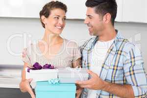 Happy woman holding many gifts from her partner