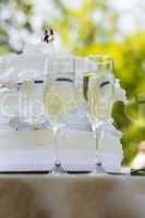 Close-up of wedding cake and champagne flutes