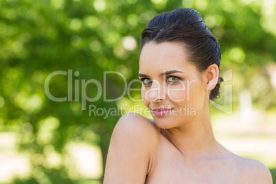 Close-up portrait of beautiful woman in park