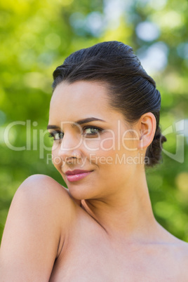 Close-up portrait of beautiful woman in park