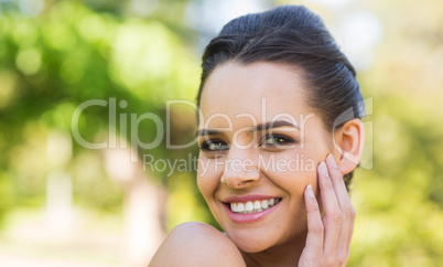 Close-up portrait of beautiful woman in park