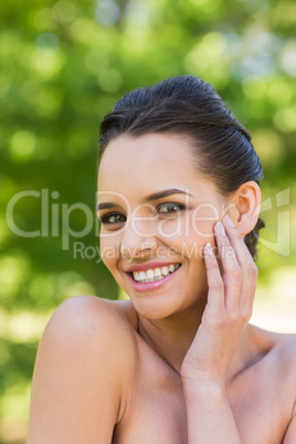 Close-up portrait of beautiful woman in park