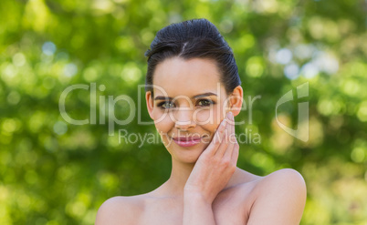 Close-up portrait of beautiful woman in park