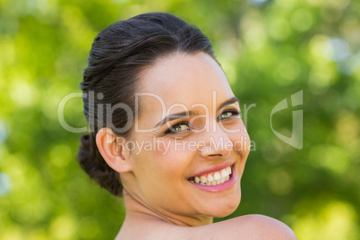 Close-up portrait of beautiful woman in park