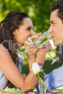 Couple drinking champagne at outdoor cafÃ©