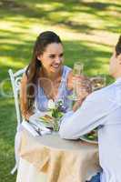 Couple drinking champagne at outdoor cafÃ©