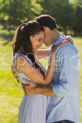 Loving young couple embracing at park