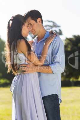 Loving couple embracing each other in park