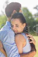 Young couple embracing at park