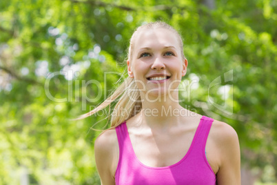 Close-up of a healthy woman in sports bra in park