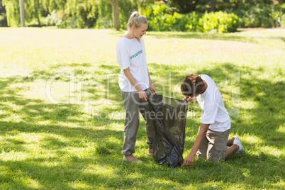 Volunteers picking up litter in park