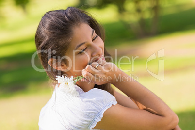 Close-up of a smiling woman holding flowers