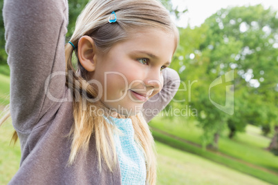 Cute smiling young girl at park