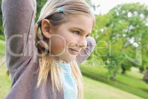 Cute smiling young girl at park