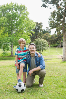 Father and son with ball at the park